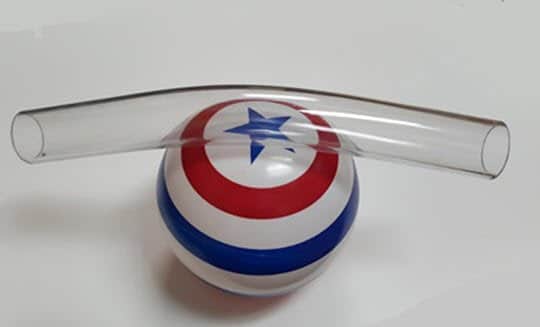 A small butyrate bend on a plastic toy ball with a blue star
