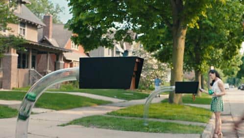 Still from the bank commercial showing pneumatic tubing connected to a mailbox.