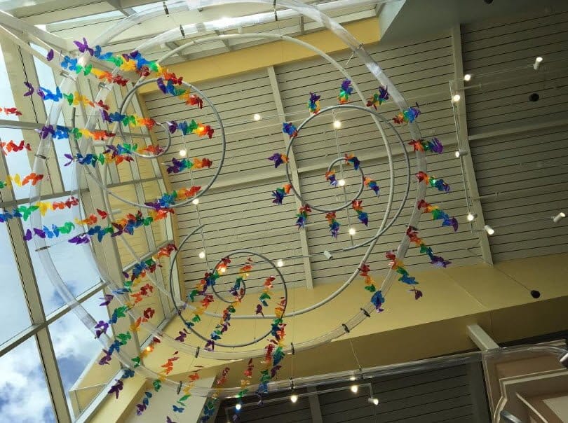 The huge pneumatic tubing helix with other hanging spirals and decorations