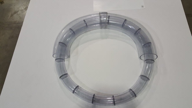 A circle of tubing made from mitered bends inside a semi-circle of two fused bends