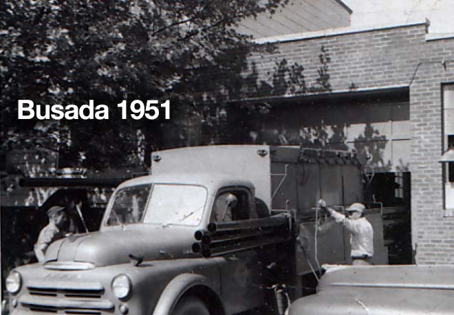 Busada workers loading tubing onto a truck in 1951