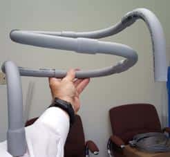 Holding a PVC model of the helix tubing system