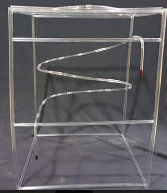 A model of the helix tubing system connected by wire to support scaffolding.