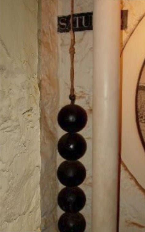 The cannonball clock weight system in the Monticello basement before the transparent tubing was installed