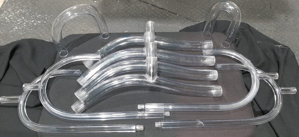 A set of many custom fabricated tubes and bends with threaded attachments and ends