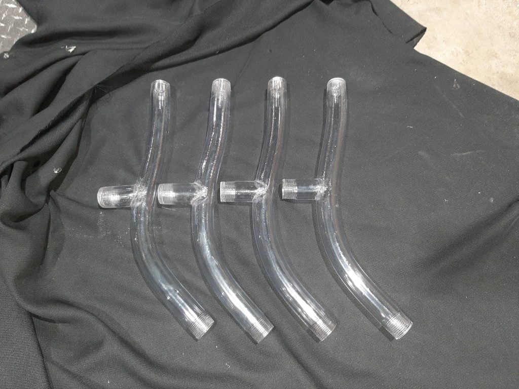 Four custom fabricated tubes with threaded attachments