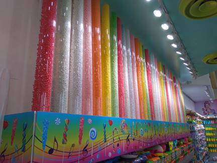 Row of candy dispensers made with clear, food-safe tubing