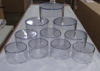 Short, capped sections of clear plastic tubing on a table