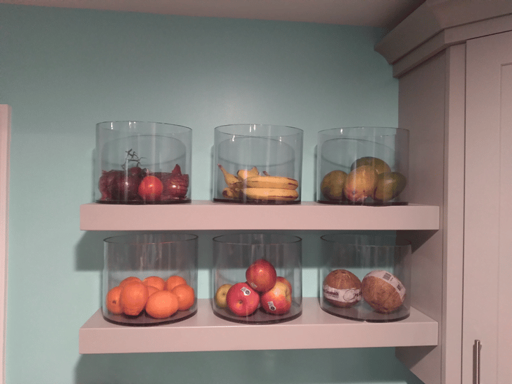 Fruit display containers made with transparent, plastic tubing.